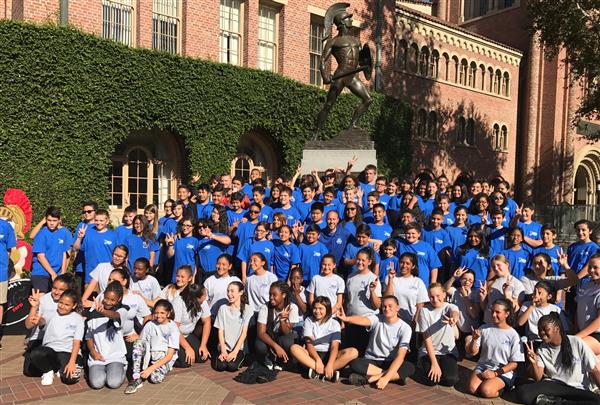 Photo of Magnolia Junior High Band members in front of the Tommy Trojan statue at USC Photo of Magnolia Junior High Band members in front of the Tommy Trojan statue at USC